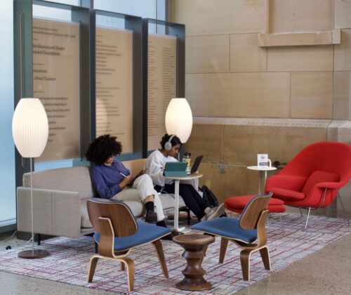 Two students, one using an iPad and another with headphones, study in the forum lounge during 'Study Days' at UMMA from April 26-28, 2024.