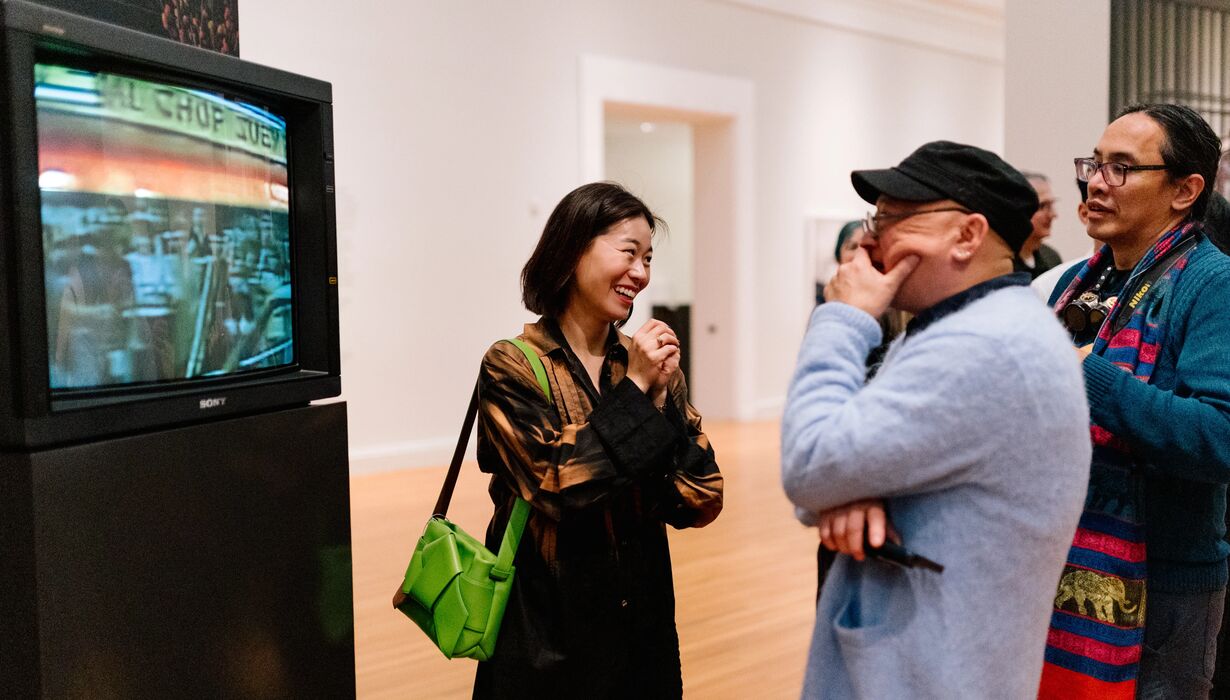 Guests walk through the exhibition space during the opening reception of 'Strange You Never Knew' a solo exhibition by Jarod Lew on Friday, January 31, 2025, at UMMA.