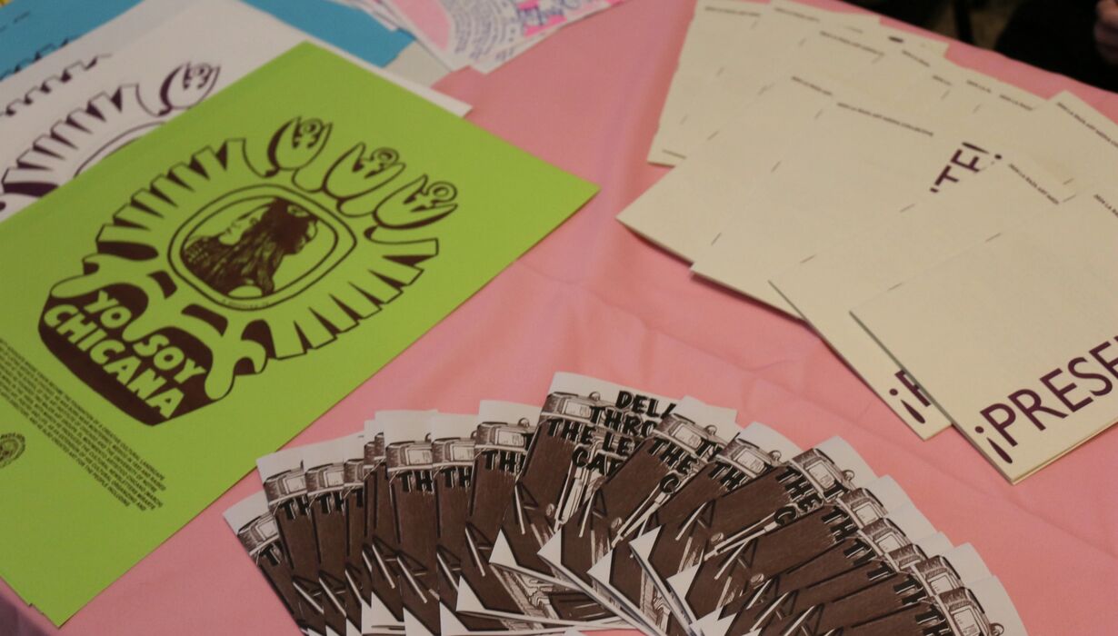 Zines placed on display tables.