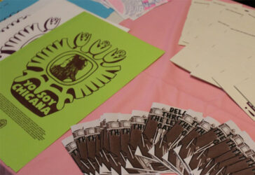 Zines placed on display tables.