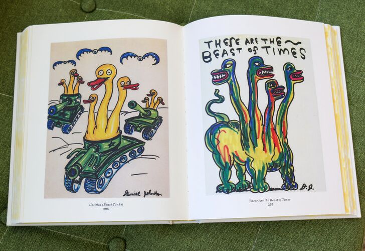 Illustrated book open to a spread featuring colorful, whimsical drawings of cartoon creatures on vehicles and one standing.