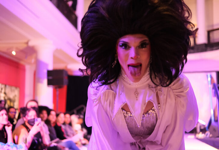 Visitors enjoy the activities at UMMA's Feel Good Friday Queer Night in February 2025, including this performance by Perry Dox