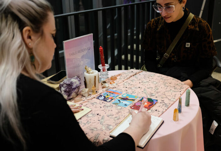 Visitors enjoy the activities at UMMA's Feel Good Friday Queer Night in February 2025, including Tarot Readings