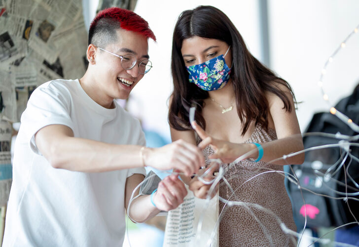 Museum visitors work on collaborative sculpture as part of UMMA's 'FUN' exhibition which was a student and community collaboration.