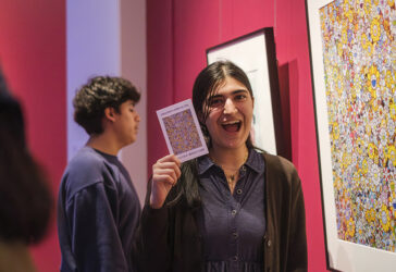 Students participate in Match Day for the "Art at Home" exhibition at UMMA, selecting original artworks from the gallery to take home for the winter semester as part of the Bridge Scholars Plus program.