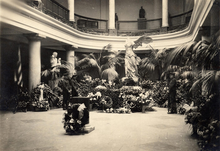 Marion Burton funeral, open coffin before Winged Victory of Samothrace, apse of Alumni Memorial Hall, 1925