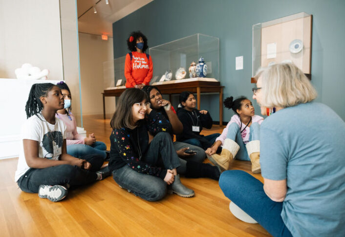 Students from Holmes Elementary discuss artwork with UMMA docent in Chinese Gallery