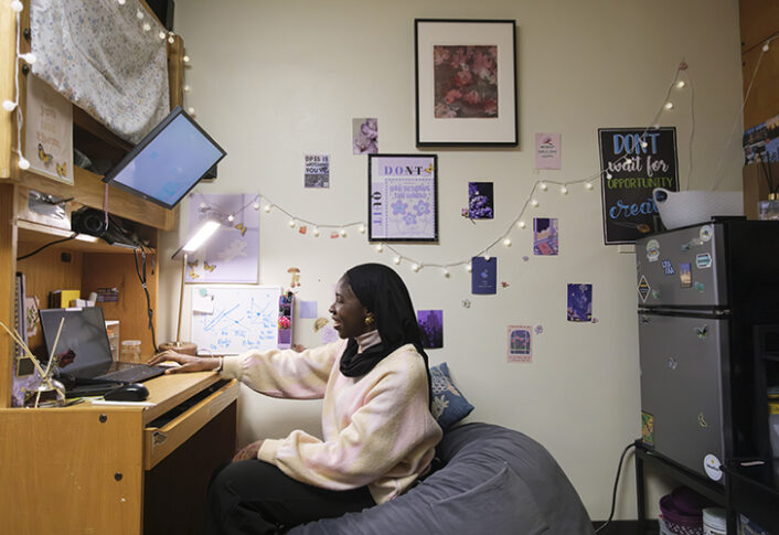 Original artworks from the Art at Home program displayed on the walls of student dorm rooms.