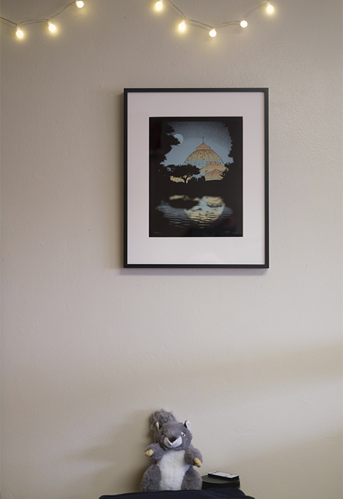 Original artworks from the Art at Home program displayed on the walls of student dorm rooms.