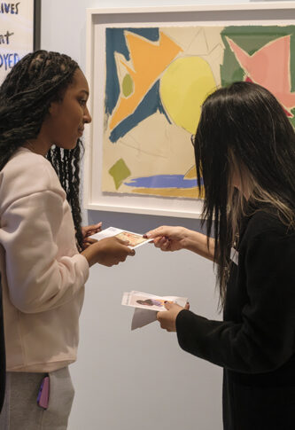 Students participate in Match Day for the "Art at Home" exhibition at UMMA, selecting original artworks from the gallery to take home for the winter semester as part of the Bridge Scholars Plus program.