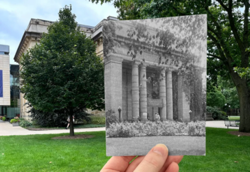 An old photo of UMMA held infront of the present-day building